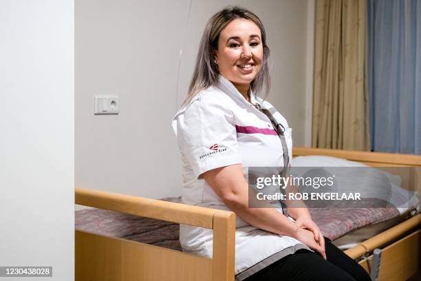 Sanna Elkadiri, employee of Het Wereldhuis nursing home, poses on January 5 in Boxtel. - Elkadiri is the first person in the Netherlands scheduled to...