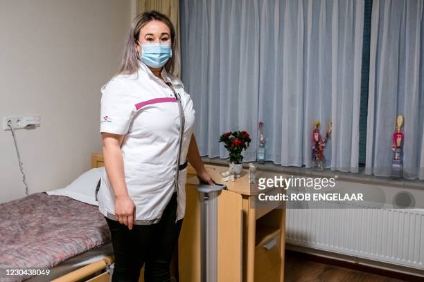 Sanna Elkadiri, employee of Het Wereldhuis nursing home, poses on January 5 in Boxtel. - Elkadiri is the first person in the Netherlands scheduled to...