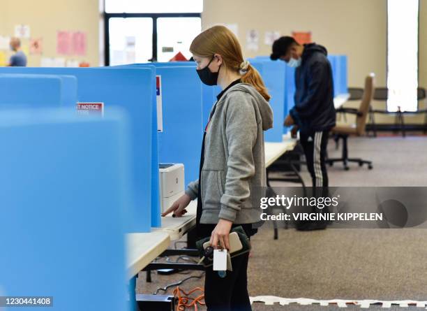 Georgia voters cast their ballots at the Chamblee Civic Center in Chanblee, Georgia, during the Georgia runoffs elections on January 5, 2021. After...