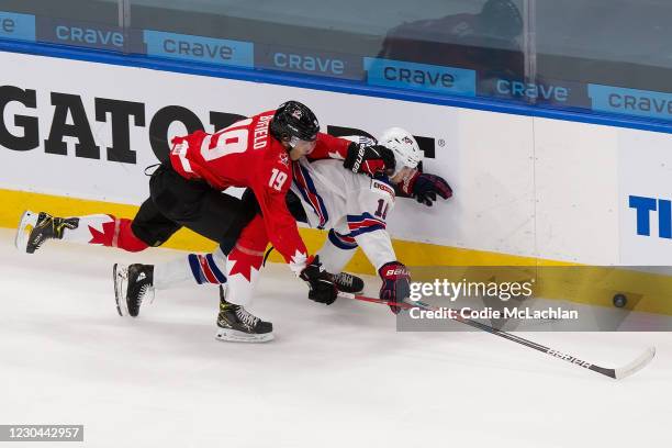 Quinton Byfield of Canada skates against Matthew Beniers of the United States during the 2021 IIHF World Junior Championship gold medal game at...
