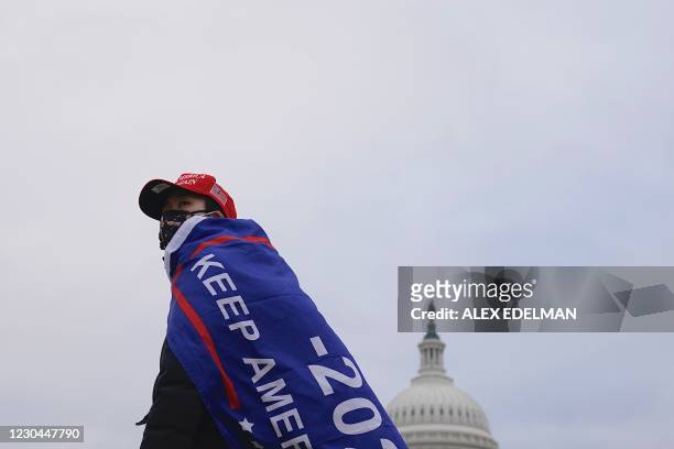 Supporter of US President Donald Trump challenging the results of the 2020 US Presidential election arrives outside the US Capitol on January 6, 2021...