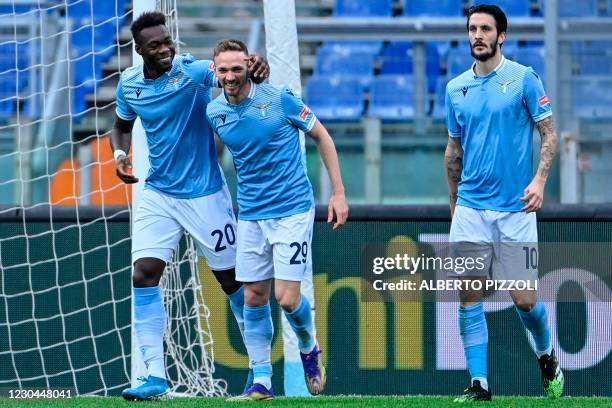 Lazio's Ecuadorian forward Felipe Caicedo celebrates with Lazio's Italian midfielder Manuel Lazzari and Lazio's Spanish midfielder Luis Alberto after...