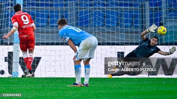 Fiorentina's Serbian forward Dusan Vlahovic scores a penalty past Lazio's Albanian goalkeeper Thomas Strakosha during the Italian Serie A football...