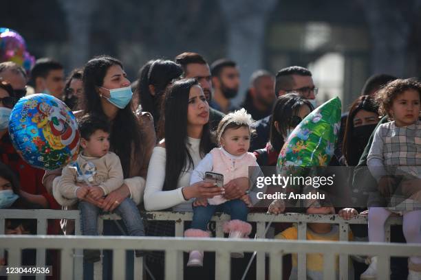 Orthodox Christians gather around the Church of the Nativity, where Jesus is believed to have been born, to attend Christmas ceremony in Bethlehem,...