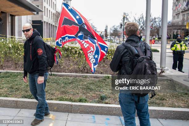 Supporter of US President Donald Trump display a Confederate flag next to Black Lives Matter Plaza as supporters from around the country rally in the...