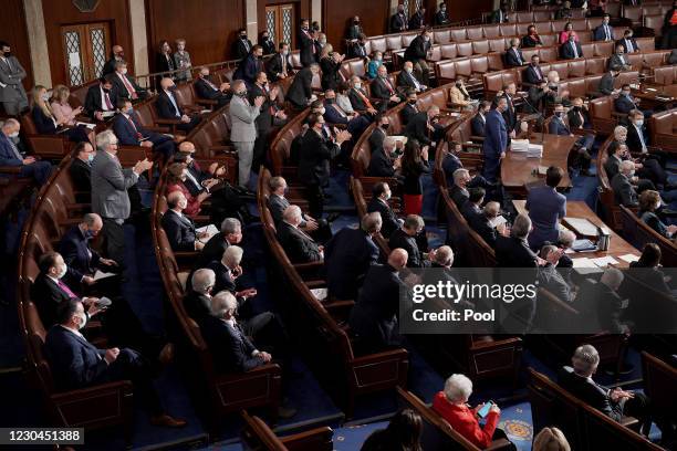 House and Senate Republicans applaud Rep. Paul Gosar and Sen. Ted Cruz during a joint session of Congress to count the Electoral College votes from...