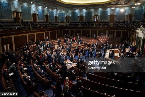 Senators and Senate clerks leave to debate the certification of Arizona's Electoral College votes from the 2020 presidential election during a joint...