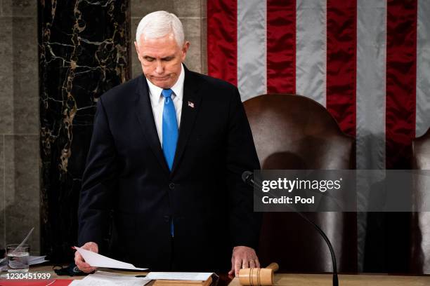 Vice President Mike Pence presides over a joint session of Congress to certify the 2020 Electoral College results on January 6, 2021 in Washington,...