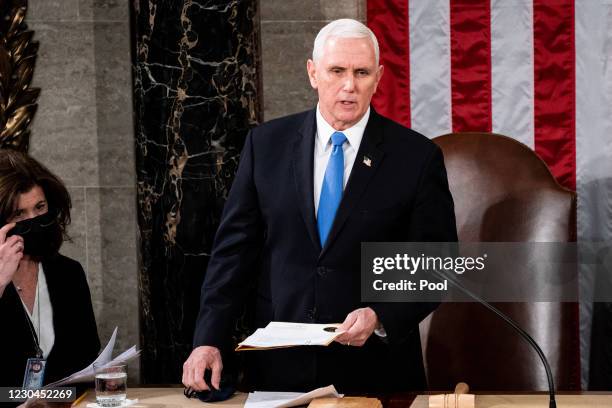 Vice President Mike Pence presides over a joint session of Congress to certify the 2020 Electoral College results on January 6, 2021 in Washington,...