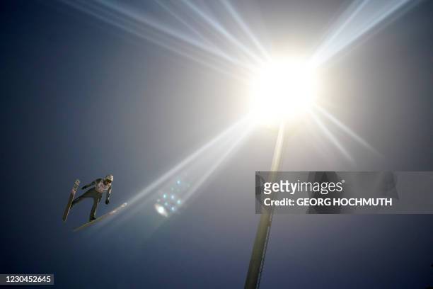 Poland's Piotr Zyla soars through the air during the first competition jump of the fourth event of the Four-Hills Ski Jumping tournament in...