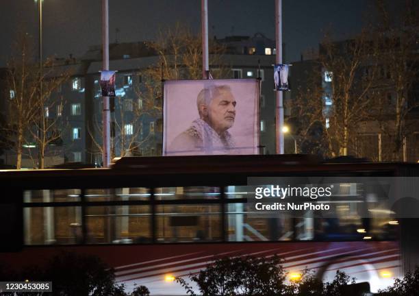 Portrait of the former commander of the IRGC Quds Force, General Qaasem Soleimani is seen on a corner of the Azadi square in western Tehran, during...