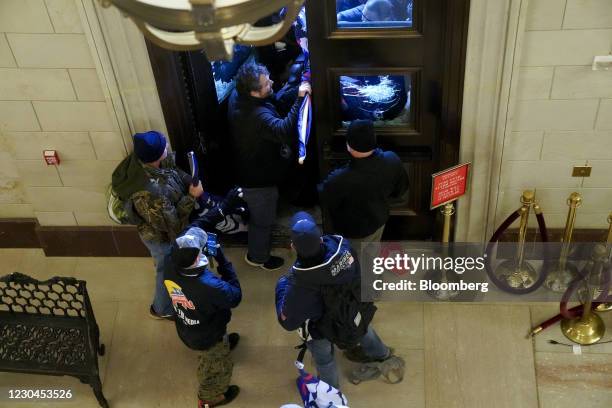 Supporters of U.S. President Donald Trump breach a door of the U.S. Capitol as a joint session of Congress to count the votes of the 2020...