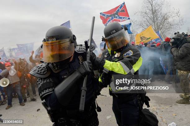 Trump supporters clash with police and security forces as they try to storm the US Capitol in Washington, DC on January 6, 2021. - Demonstrators...