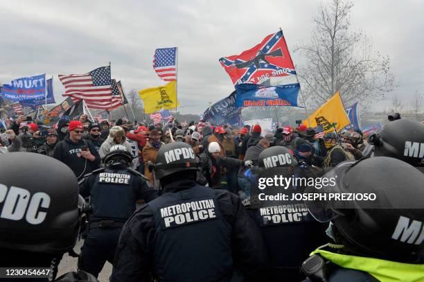 Trump supporters clash with police and security forces as they storm the US Capitol in Washington D.C on January 6, 2021. Demonstrators breeched...