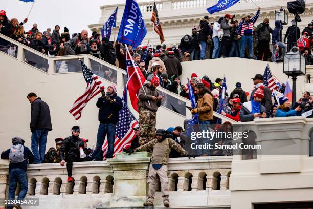 Pro-Trump supporters storm the U.S. Capitol following a rally with President Donald Trump on January 6, 2021 in Washington, DC. Trump supporters...