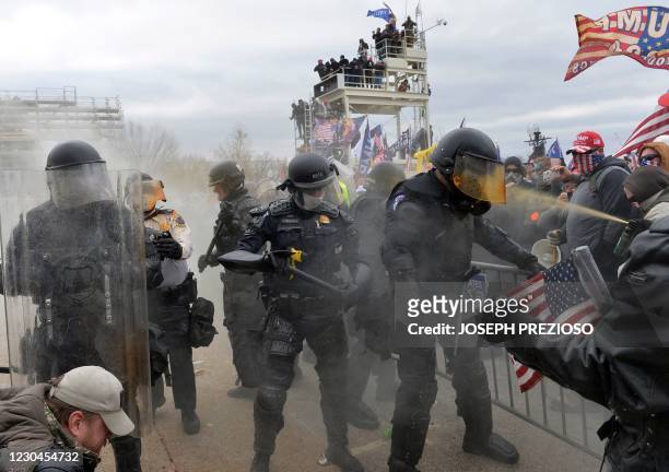 Trump supporters clash with police and security forces as they try to storm the US Capitol in Washington, DC on January 6, 2021. - Demonstrators...