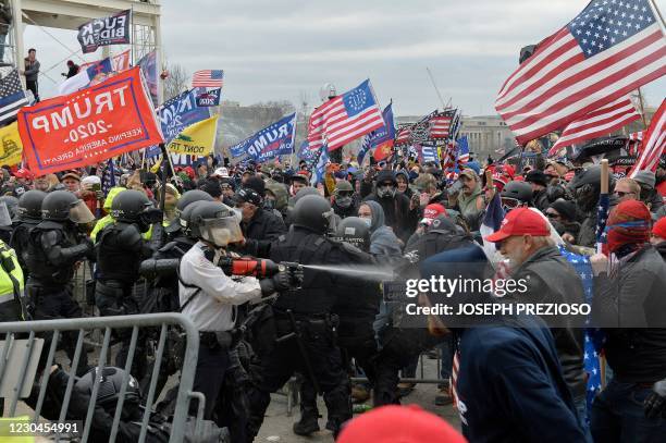 Trump supporters clash with police and security forces as they try to storm the US Capitol in Washington, DC on January 6, 2021. - Demonstrators...