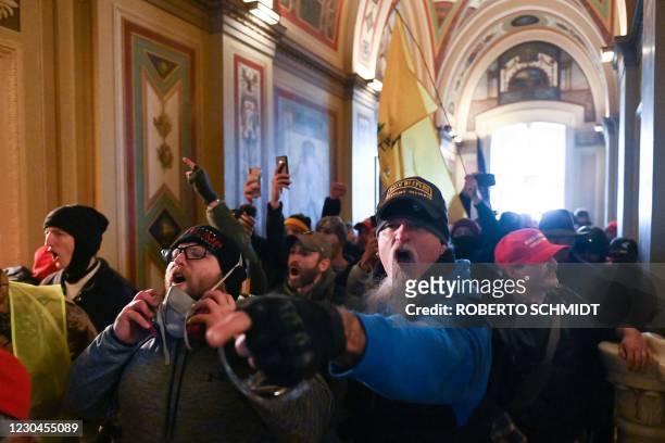 Supporters of US President Donald Trump protest inside the US Capitol on January 6 in Washington, DC. - Demonstrators breeched security and entered...
