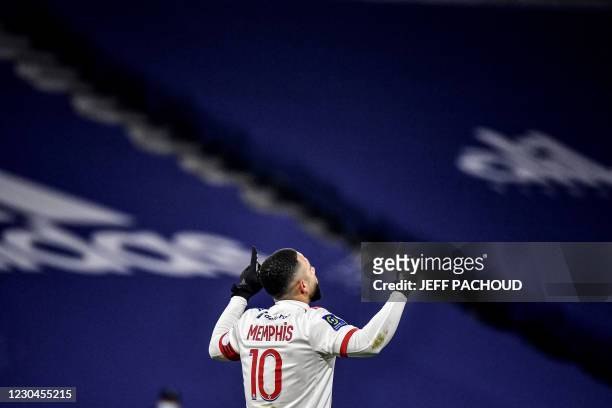 Lyon's Dutch forward Memphis Depay celebrates after scoring during the French L1 football match between Lyon and RC Lens at The Groupama Stadium at...