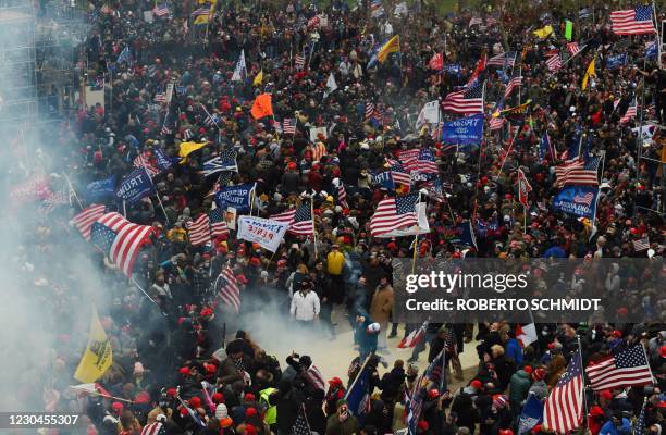 Trump supporters clash with police and security forces as they storm the US Capitol in Washington D.C on January 6, 2021. - Demonstrators breeched...