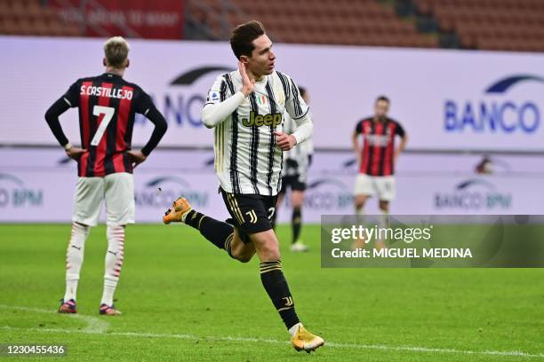 Juventus' Italian forward Federico Chiesa celebrates after scoring his second goal during the Italian Serie A football match AC Milan vs Juventus on...