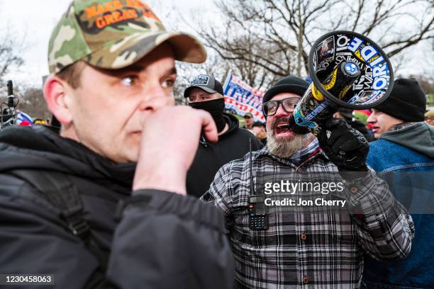 Joseph Biggs, a Proud Boys leader, uses a megaphone during a march in front of the Capitol Building on January 6, 2021 in Washington, DC. A pro-Trump...