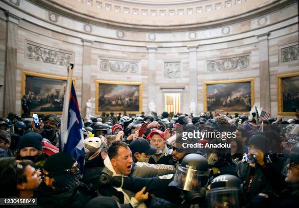 Police clash with supporters of US President Donald Trump who breached security and entered the Capitol building in Washington D.C., United States on...