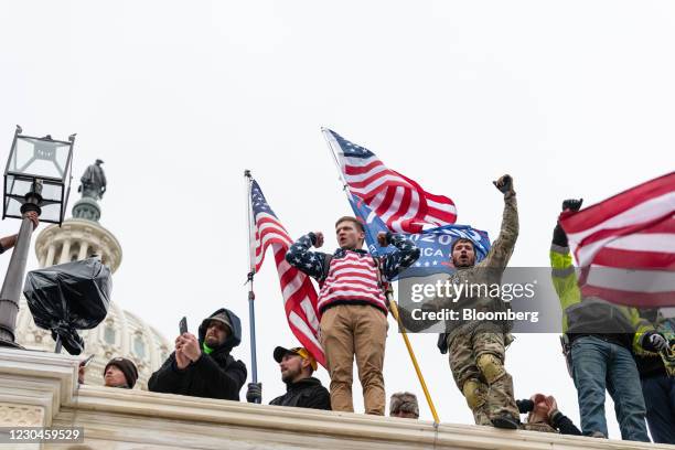 Demonstrators swarm the U.S. Capitol building during a protest in Washington, D.C., U.S., on Wednesday, Jan. 6, 2021. The U.S. Capitol was placed...