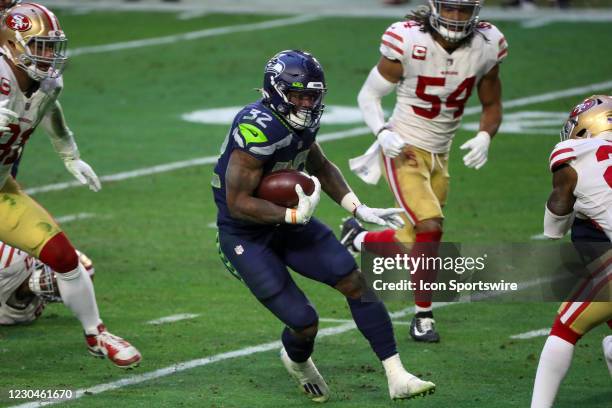 Seattle Seahawks Running Back Chris Carson runs with a ball during a game against the San Francisco 49ers at State Farm Stadium on January 3, 2021 in...