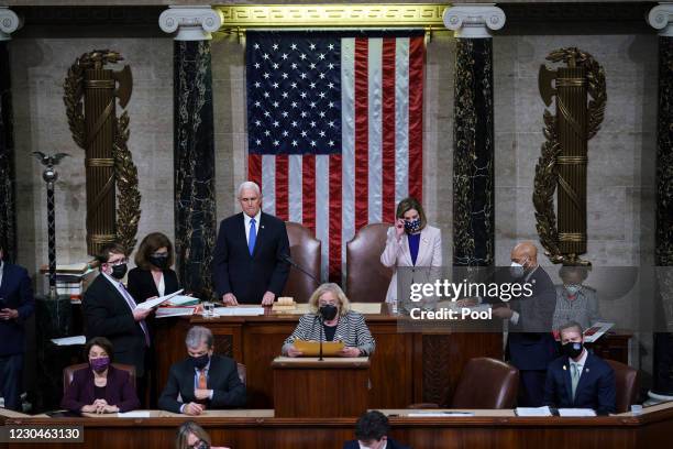 Vice President Mike Pence and Speaker of the House Nancy Pelosi, D-Calif., prepare to read the final certification of Electoral College votes cast in...