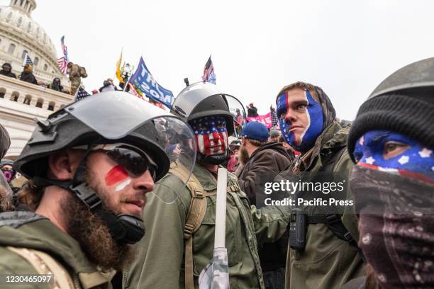 Pro-Trump protesters trying to enter Capitol building. Rioters broke windows and breached the Capitol building in an attempt to overthrow the results...