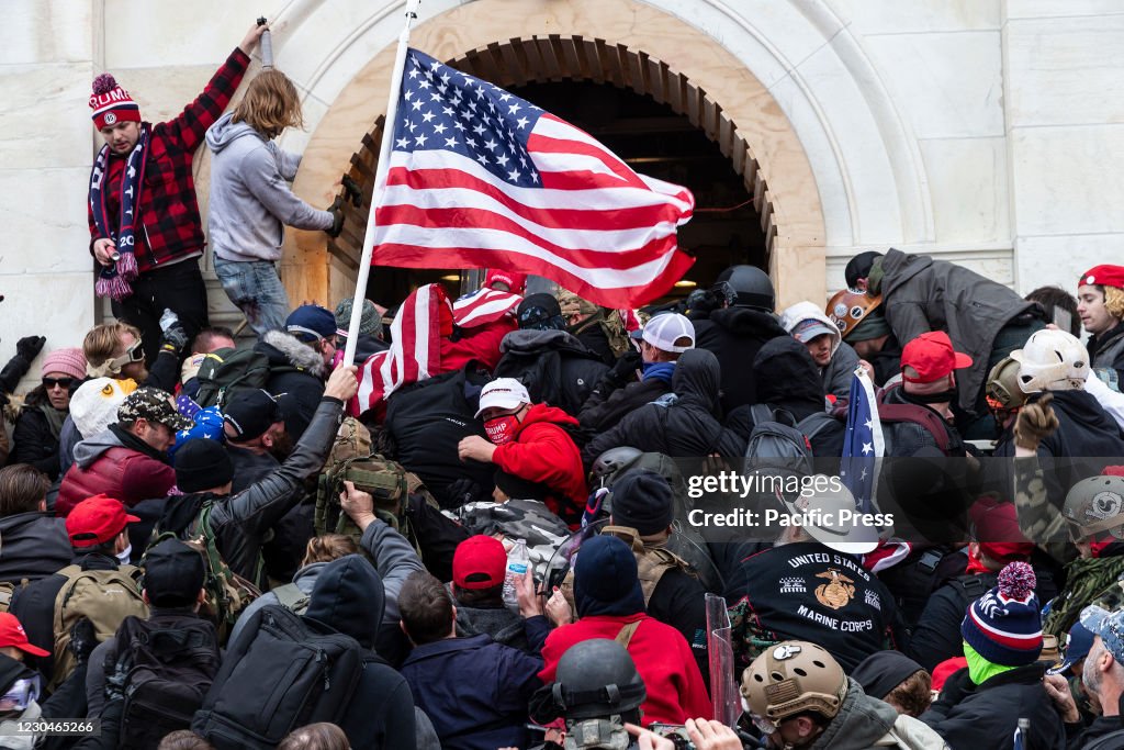 Rioters clash with police trying to enter Capitol building...