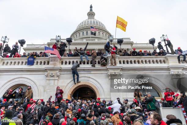 Protesters seen all over Capitol building where pro-Trump supporters riot and breached the Capitol. Rioters broke windows and breached the Capitol...