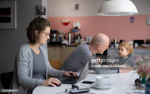 Bonn, Germany In this photo illustration a family in times of corona lockdown is sitting in the kitchen on January 07, 2021 in Bonn, Germany. The...