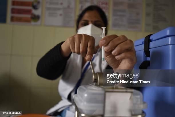 Health worker disposes a syringe during a dry run of the Covid-19 vaccination programme, at UPHC Bhangrola on January 7, 2021 in Gurugram, India. A...