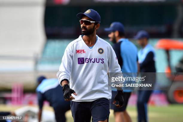 Indian captain Ajinkya Rahane attends a warmup session prior the play on day two of the third cricket Test match at Sydney Cricket Ground between...