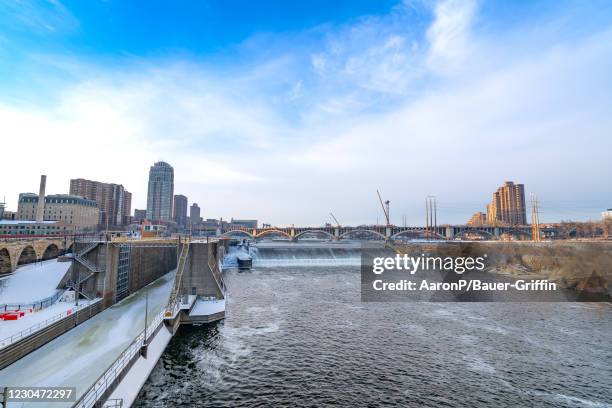 General views of Saint Anthony Falls pouring into the Mississippi River and Saint Anthony Fall Lock and Dam on January 07, 2021 in Minneapolis,...