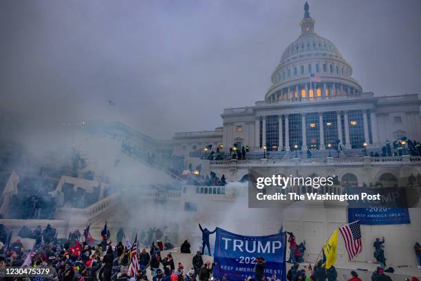 Tear gas is fired at supporters of President Trump who stormed the United States Capitol building.