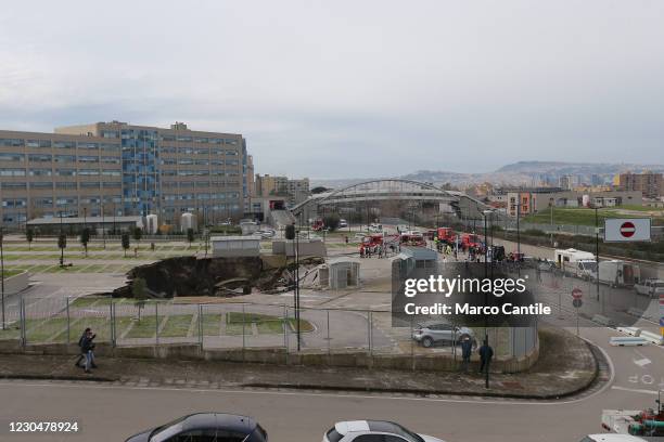 View of the huge chasm that opened, following an explosion, in the parking lot of the Ospedale del Mare in Naples, in the Ponticelli district.