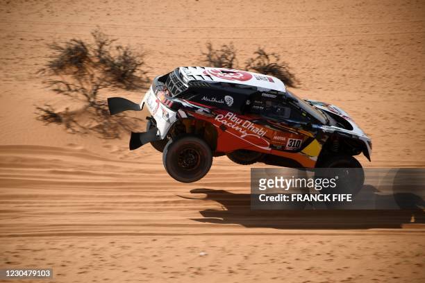 Peugeot's driver Khalid Sheikh Al Qassimi of Saudi Arabia and co-driver French Xavier Panseri compete during the 6th Stage of the Dakar Rally 2021...
