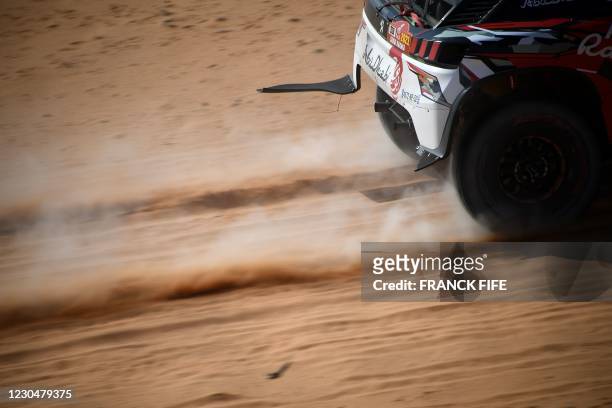 Peugeot's driver Khalid Sheikh Al Qassimi of Saudi Arabia and co-driver French Xavier Panseri compete during the 6th Stage of the Dakar Rally 2021...