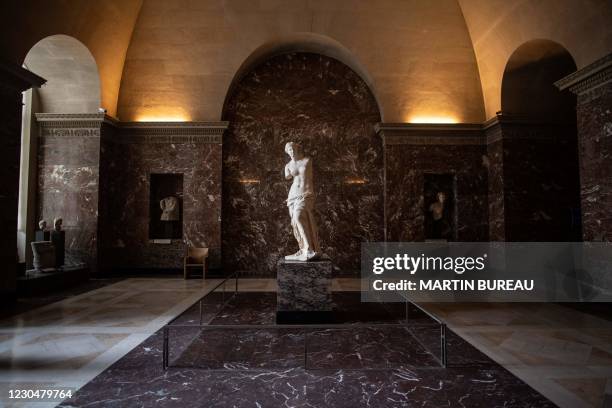 Picture taken on January 8, 2021 at the Louvre Museum in Paris shows the Venus of Milo sculpture in an empty hall, as the Museum remains closed due...