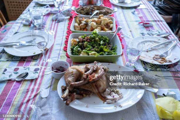 Table of food leftovers, the remnants of Christmas excess on Christmas Day, on 25th December 2020 in London, England. Christmas lunch or dinner in...