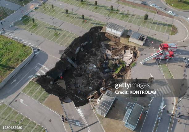 The huge chasm, 2500 meter square for 15 meter deep, caused by explosion of hospital oxigen underground pipeline at the car park of the CoVid19...