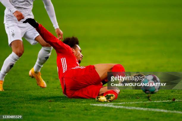 Bayern Munich's German midfielder Leroy Sane vies for the ball during the German first division Bundesliga football match Borussia Moenchengladbach v...