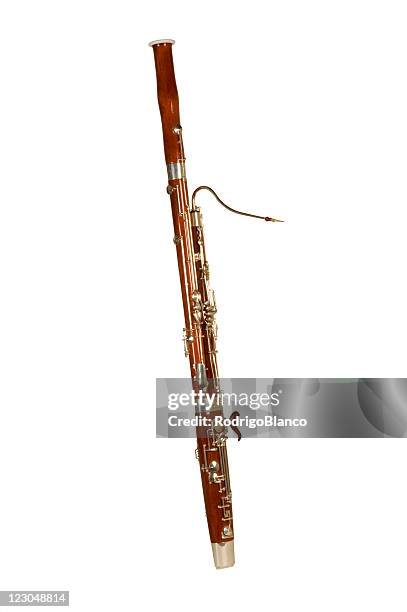 a bassoon alone on a white background - wind instrument stock pictures, royalty-free photos & images