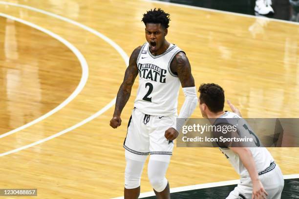 Michigan State Spartans guard Rocket Watts celebrates a great assist right before halftime during a college basketball game between the Michigan...