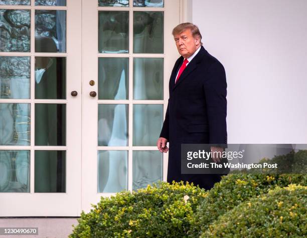 December 31: President Donald Trump walks to the Oval Office after he and First Lady Melania Trump arrive on the South Lawn of the White House after...