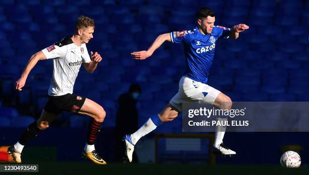 Rotherham's English striker Michael Smith chases Everton's English defender Michael Keane during the English FA Cup third round football match...