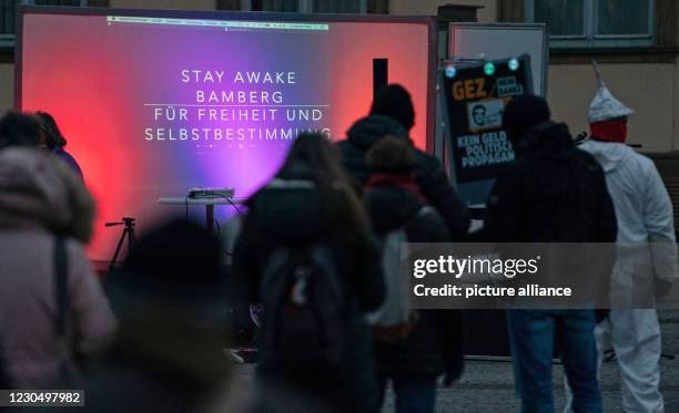 January 2021, Bavaria, Bamberg: At a rally against the Corona restrictions, the words "Stay Awake Bamberg" can be read on an area. According to...